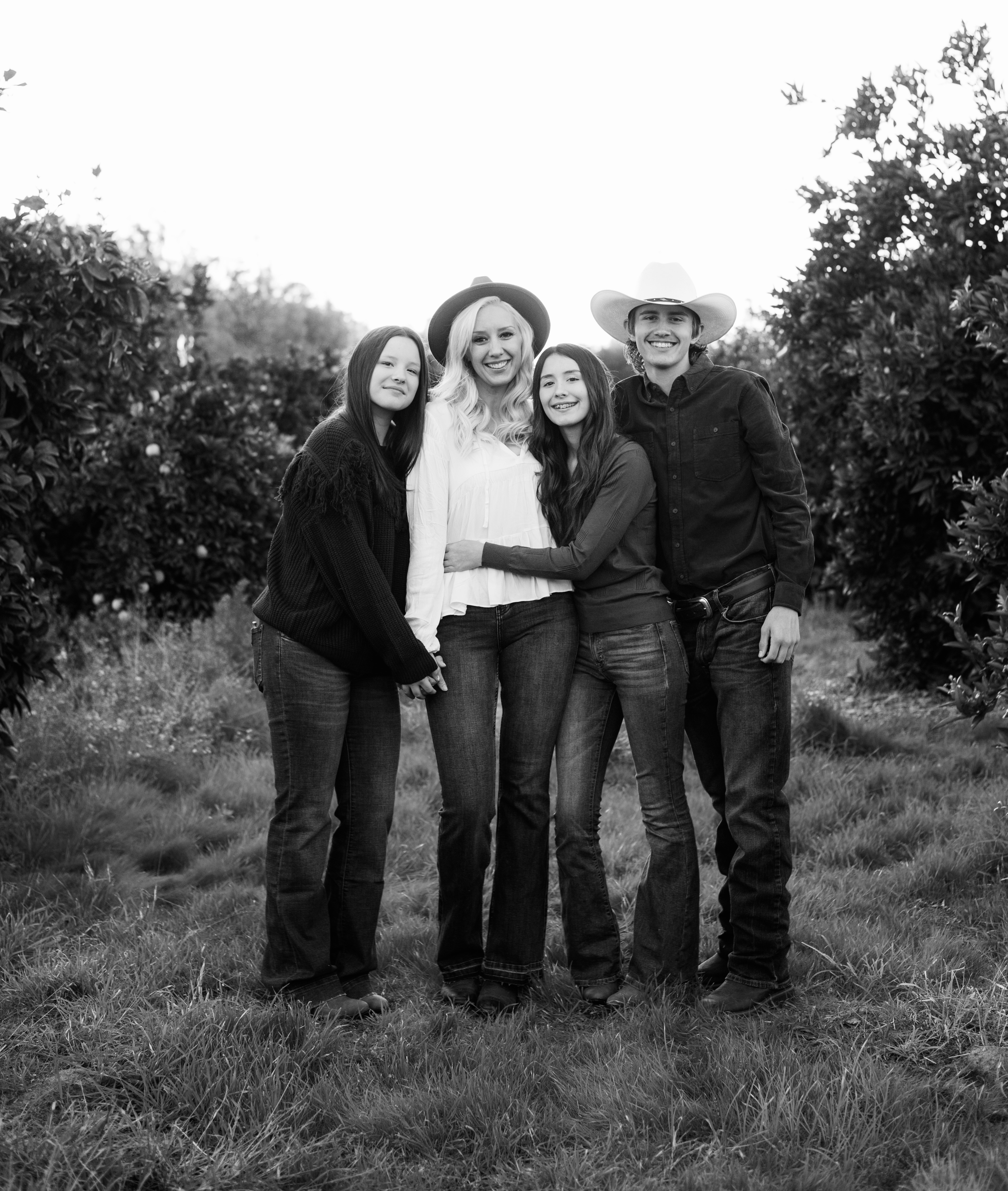 Whitney Lasater and family in a Central Valley orchard